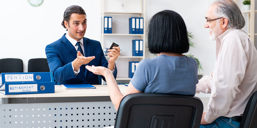 Financial advisor giving retirement advice to old couple